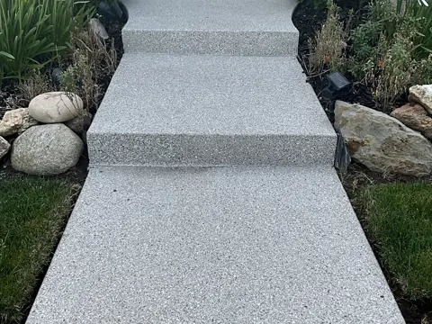 Corky M.'s front steps and walkway finished in a light flake coating.