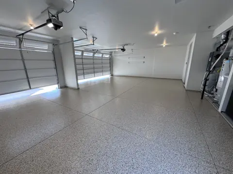 Jeff S.'s finished garage floor in a gray flake coating.