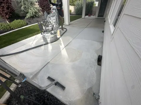 Jeremy S.'s patio during concrete grinding, before the coating went down.